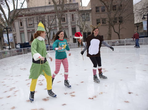 Left to right, sisters Maureen and Leslie Campbell and Nora Sutton go ice skating every year together on Christmas Eve. Nora's sister, Roberta Sutton is missing Christmas because she's working in Sierra Leone, so they made a cut-out of her face.